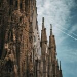 Close-up of the stunning Sagrada Familia showcasing gothic architecture under a vibrant sky.